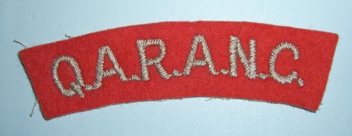 QARANC - (Queen Alexandra's Royal Army Nursing Corps) Embroidered Grey on Red Felt Cloth Shoulder Title