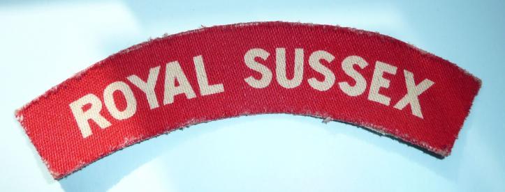 WW2 Royal Sussex Regiment Printed White on Red Cloth Shoulder Title