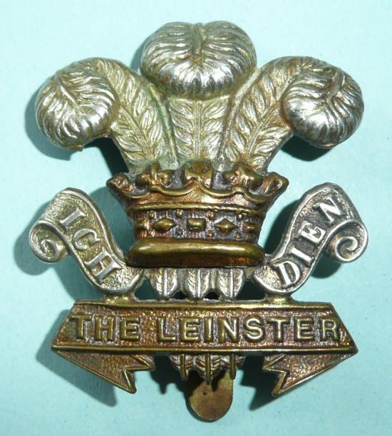 Prince of Wales Leinster Regiment ( 100th & 109th Foot) WW1 issue Bi Metal Cap Badge - Curly Scrolls Pattern