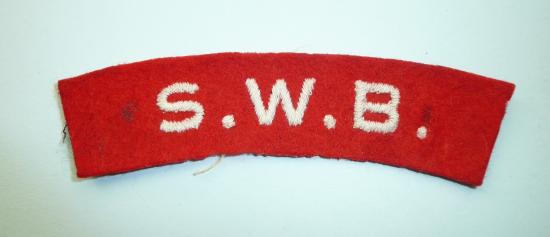 SWB ( South Wales Borderers ) Embroidered White on Red Felt Cloth Shoulder Title, worn 1943