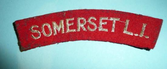 WW2 Somerset L I (Light Infantry) Embroidered White on Red Felt Cloth Shoulder Title