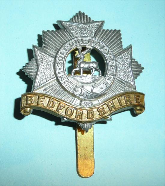The Bedfordshire Regiment Edwardian Other Ranks Bi-metal Cap Badge, long slider