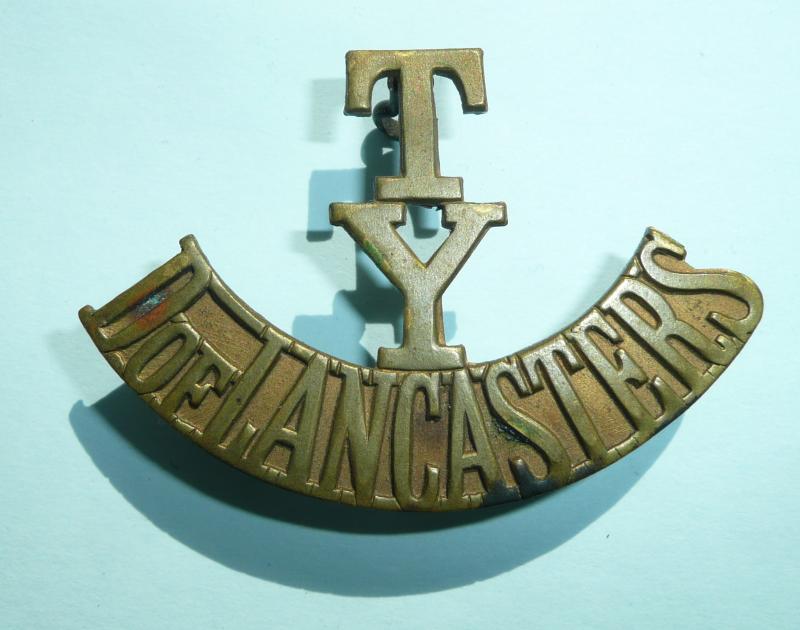 T / Y / D of Lancasters Yeomanry Unvoided One Piece Brass Shoulder Title