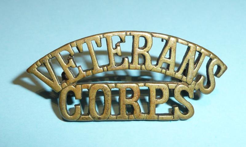 WW1 Veterans Corps one piece brass shoulder title