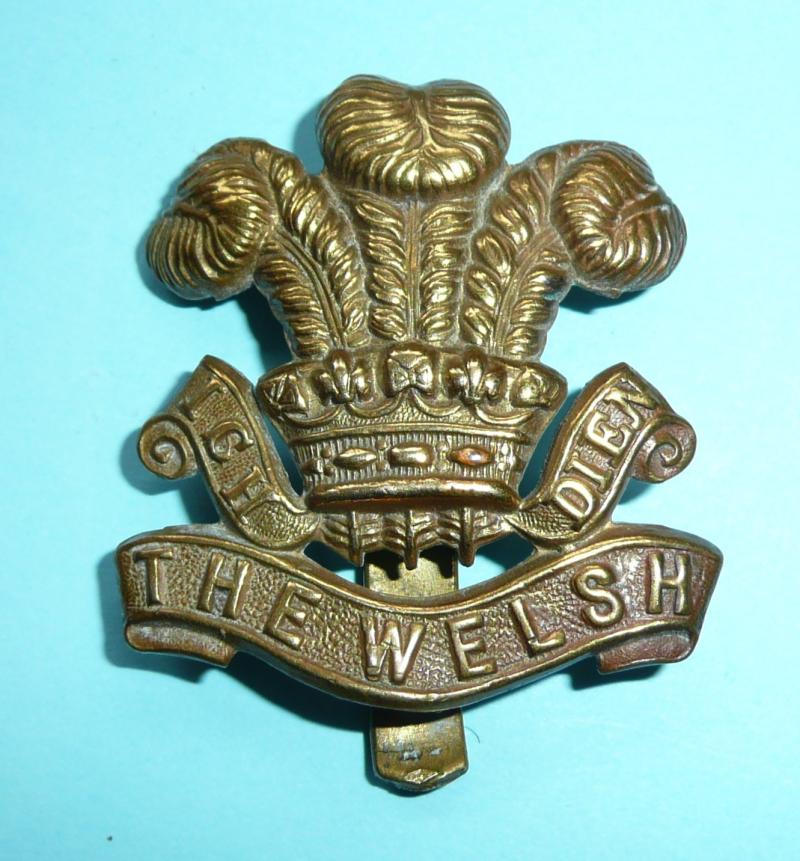 WW1 Welsh Regiment Economy All Brass Gilding Metal Cap Badge