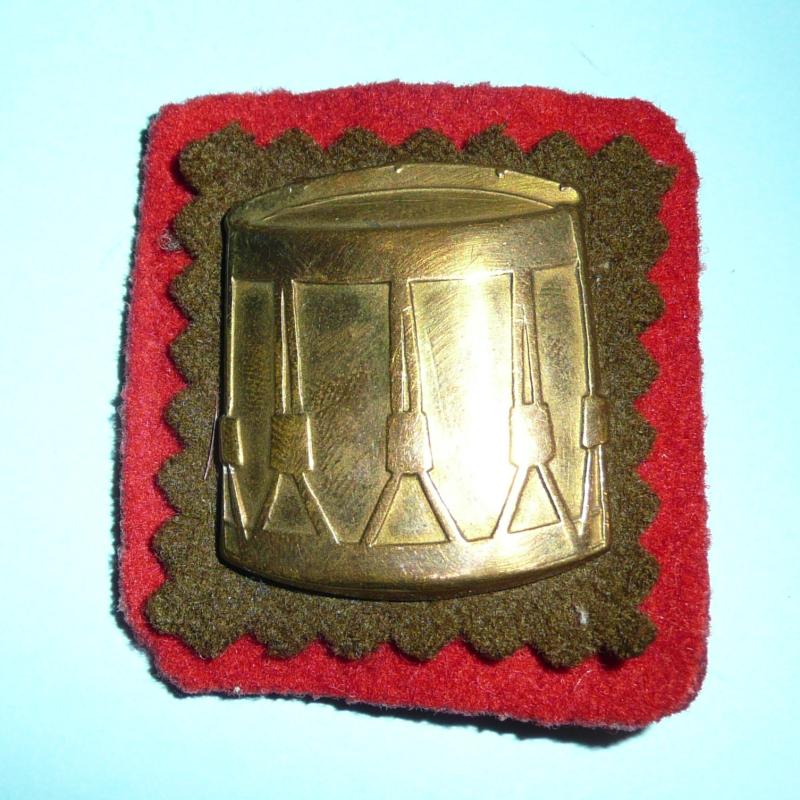 Brass Drummers Proficiency Trade Arm Badge on Backing Plate - Backing Cloth of Gosling Green indicating Royal Northumberland Fusiliers (RNF)