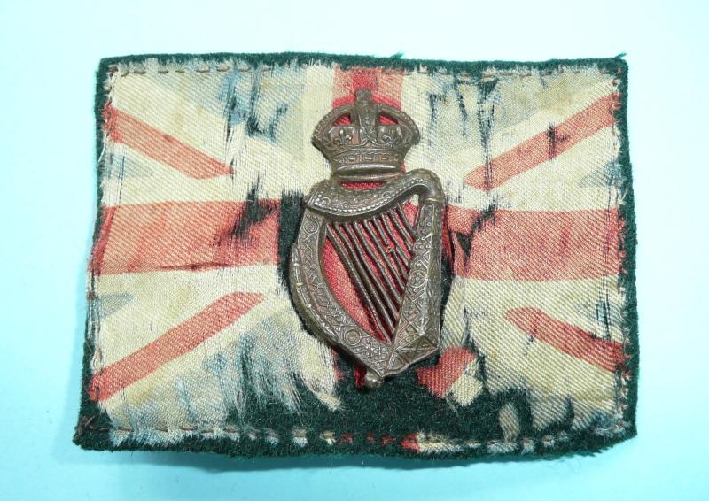 Ireland -  Royal Irish Constabulary Auxiliaries - Tudor's Toughs Cap Badge on original Silk Union Flay Backing