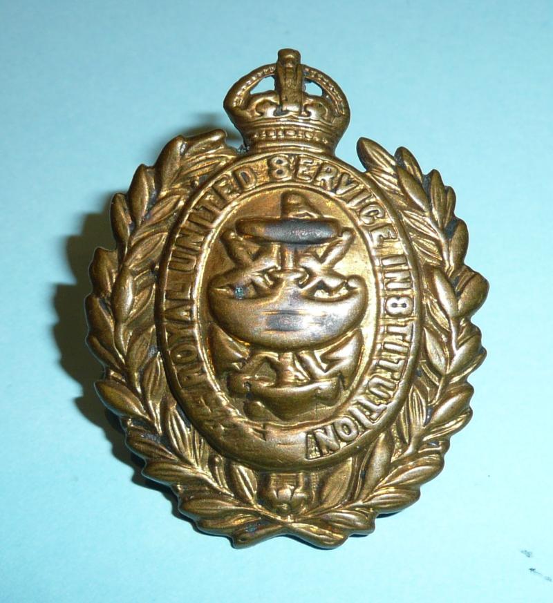 RUSI The Royal United Services Institute Brass Front Door Uniformed Security Personnel Cap Badge - Kings Crown